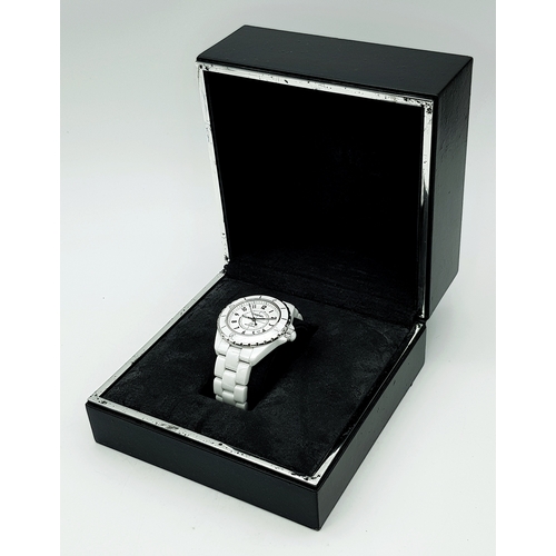 107 - A Chanel J12 Automatic Ceramic Ladies Watch. White ceramic bracelet and case - 38mm. Opaque white di... 