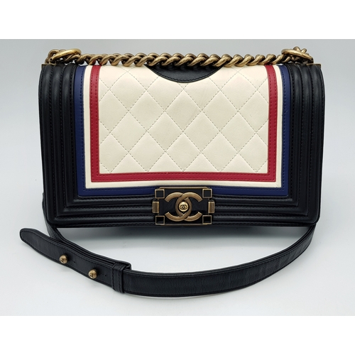 A Tricolour Chanel Boy Flap Quilted Leather Shoulder Bag. Quilted leather exterior in cream, red and blue with black leather trim, gold-tone hardware, chain and leather strap and front flap with push-lock closure. Black leather interior with one main compartment and side pocket. Some signs of wear, stains and scratches to the leather. Approx 25cm length x 15cm height x 6cm depth. Comes with a purchased receipt and dust cover. Please see photos or request a condition report.