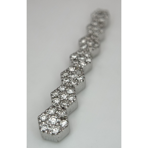 36 - AN 18K WHITE GOLD, DIAMOND SET, DROP PENDANT. 0.40 CTW. 4.8G. SC 8055