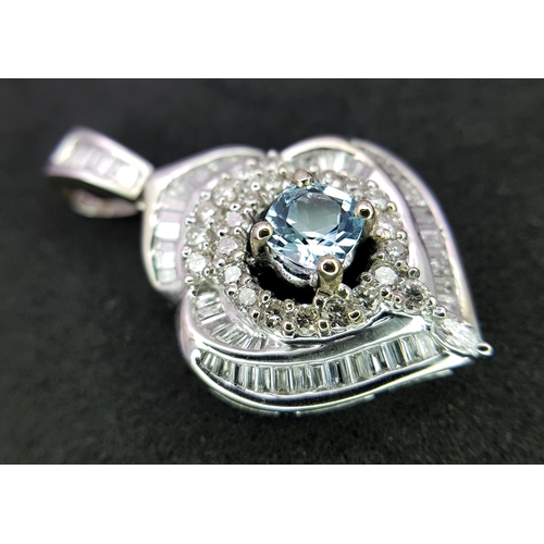 43 - AN 18K WHITE GOLD, DIAMOND AND AQUAMARINE SET, FANCY PENDANT. 0.90CTW. 9.6G. 6429