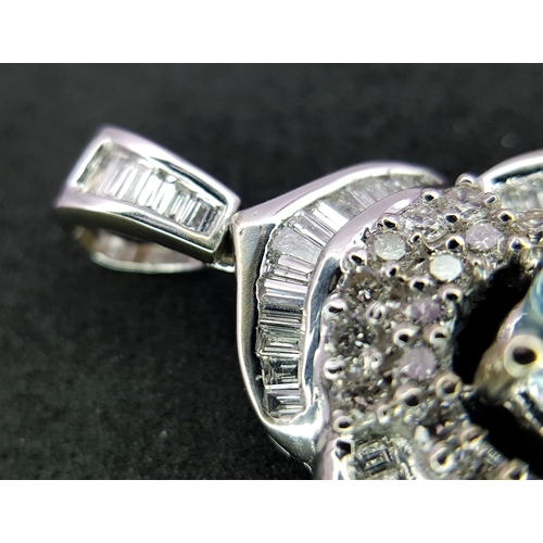 43 - AN 18K WHITE GOLD, DIAMOND AND AQUAMARINE SET, FANCY PENDANT. 0.90CTW. 9.6G. 6429