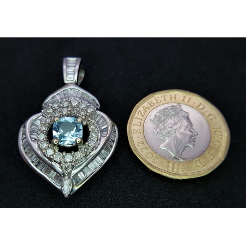 43 - AN 18K WHITE GOLD, DIAMOND AND AQUAMARINE SET, FANCY PENDANT. 0.90CTW. 9.6G. 6429