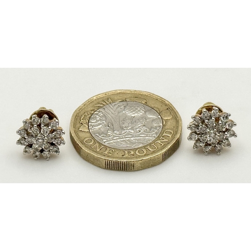 64 - A PAIR OF, 18K YELLOW GOLD, DIAMOND SET, CLUSTER STID EARRINGS. 0.50 CTW. 4.4G. SC 8050