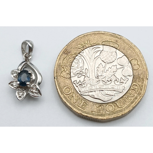 1262 - An 18K White Gold and Sapphire Pendant. 15mm. 1.1g. NL-7557.