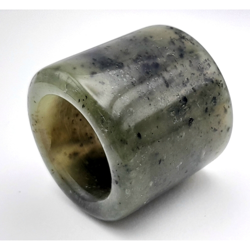636 - A Vintage Nephrite Jade Green Archers Ring Size Z+1. The ring measures 3.2cm Length and has a gross ... 