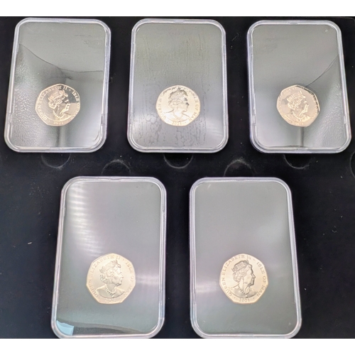 645 - A Very Collectible Alice Through The Looking Glass 50p Coin Collectors Edition. Five coins each sepa... 