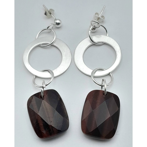 650 - A Pair of Sterling Silver and Tigers Eye Earrings. 5.7cm Drop. The Tigers Eye measures 2 x 1.4cm and... 