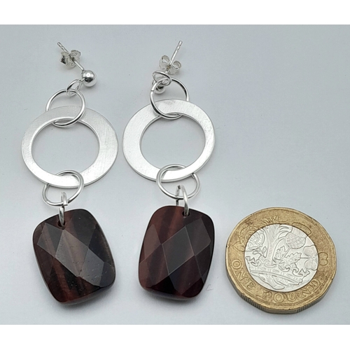 650 - A Pair of Sterling Silver and Tigers Eye Earrings. 5.7cm Drop. The Tigers Eye measures 2 x 1.4cm and... 
