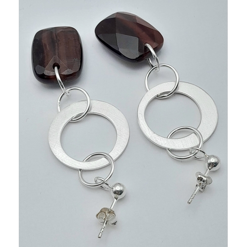 650 - A Pair of Sterling Silver and Tigers Eye Earrings. 5.7cm Drop. The Tigers Eye measures 2 x 1.4cm and... 