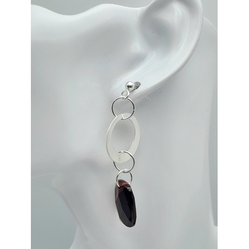 650 - A Pair of Sterling Silver and Tigers Eye Earrings. 5.7cm Drop. The Tigers Eye measures 2 x 1.4cm and... 