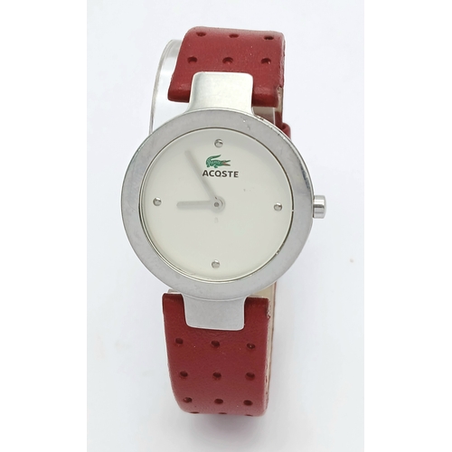 677 - A LACOSTE, RED LEATHER STRAP WATCH. ORIGINAL STRAP AND BUCKLE. IN FULL WORKING ORDER. NEW BATTERY FI... 