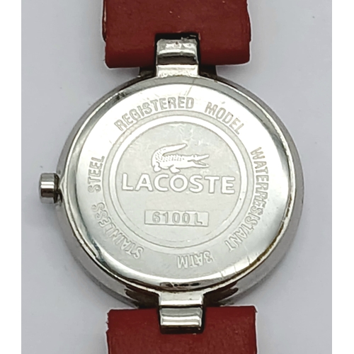 677 - A LACOSTE, RED LEATHER STRAP WATCH. ORIGINAL STRAP AND BUCKLE. IN FULL WORKING ORDER. NEW BATTERY FI... 