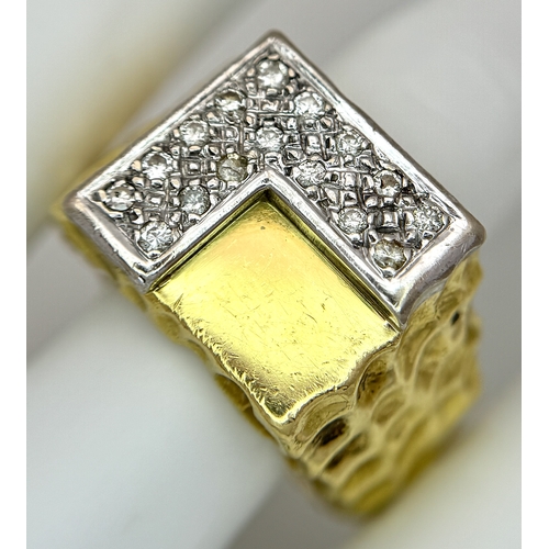 11 - A Statement 18K Yellow Gold and Diamond Gents Signet Ring. Dimple effect band with an 'L' shaped dia... 