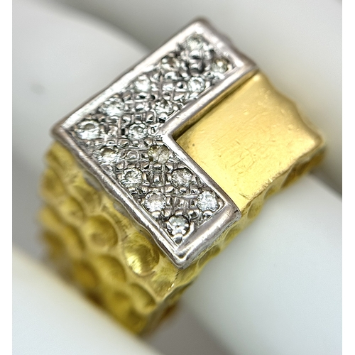 11 - A Statement 18K Yellow Gold and Diamond Gents Signet Ring. Dimple effect band with an 'L' shaped dia... 