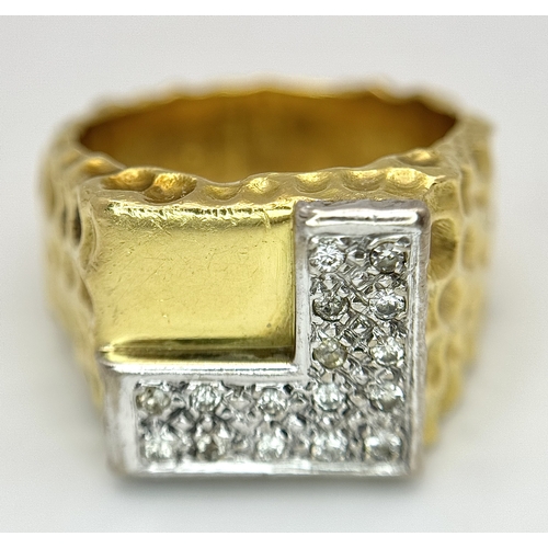 11 - A Statement 18K Yellow Gold and Diamond Gents Signet Ring. Dimple effect band with an 'L' shaped dia... 