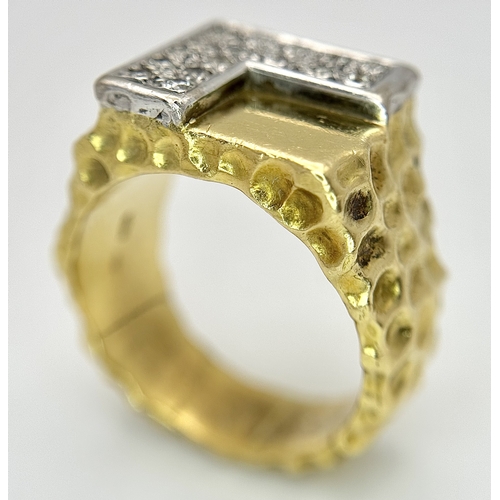11 - A Statement 18K Yellow Gold and Diamond Gents Signet Ring. Dimple effect band with an 'L' shaped dia... 
