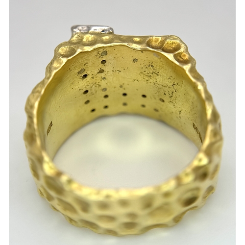 11 - A Statement 18K Yellow Gold and Diamond Gents Signet Ring. Dimple effect band with an 'L' shaped dia... 