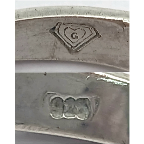 1211 - A Stylish Sterling Silver Tiffany Style Mounted Blue Topaz Solitaire Ring Size Q. The Ring is set wi... 