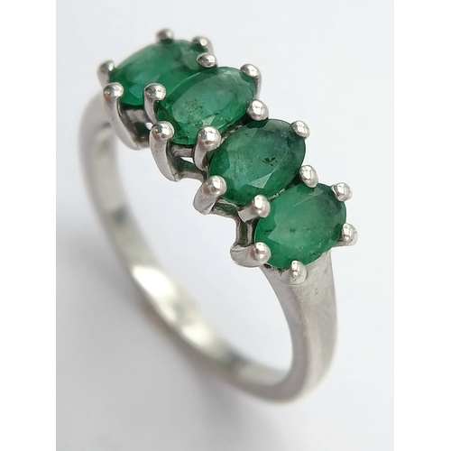 1218 - A Stylish Sterling Silver and Four Emerald Set Ring Size S. The Ring is set with Four Oval Cut 6 x 4... 