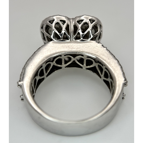 614 - A 9K WHITE GOLD, MIXED CUT, DIAMOND SET, FANCY HEART DESIGN RING. 1.96CTW APPROX. 7.6G, SIZE M. SPSA... 