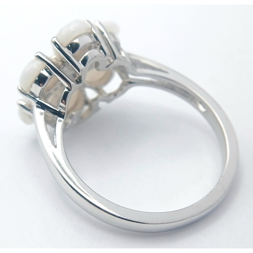 615 - A Pretty Sterling Silver and Opal Set Flower Design Ring Size T. Appears practically unworn if worn ... 