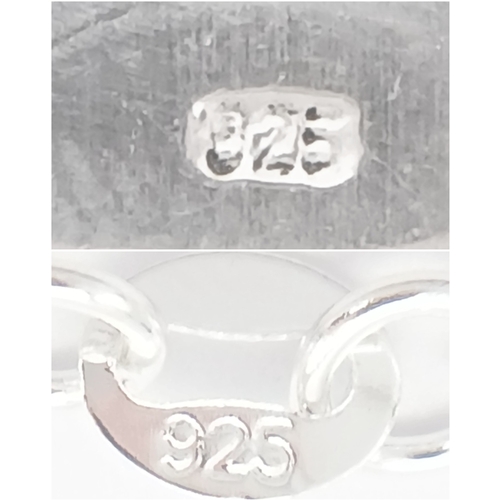 629 - A Stylish Sterling Silver Blue Topaz Pendant Necklace-46cm Length Chain. Set with a 9 x 7mm Rectangl... 