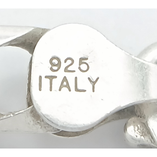 692 - A Heavy Sterling Silver Curb Link Chain Necklace-50cm Length. The Necklace measures 6mm Wide and has... 