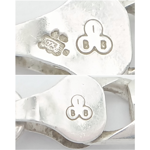 692 - A Heavy Sterling Silver Curb Link Chain Necklace-50cm Length. The Necklace measures 6mm Wide and has... 