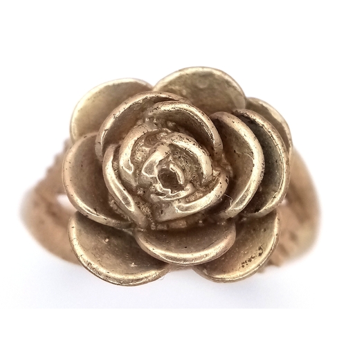 26 - A 9K Yellow Gold Ring with Ornate Rose Decoration. Size M 1/2. 5.95g.