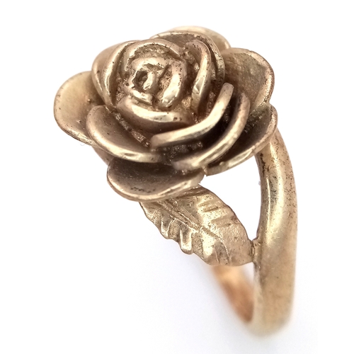 26 - A 9K Yellow Gold Ring with Ornate Rose Decoration. Size M 1/2. 5.95g.