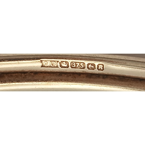 51 - A 9K GOLD TORQUE STYLE BANGLE WITH 2 PALE AMETHYST STONES , (ONE SMALL KINK HENCE LOW PRICE)    8.8g... 