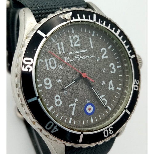 670 - A BEN SHERMAN, THE ORIGINAL, GREY MILITARY MATERIAL STRAP WATCH. IN FULL WORKING ORDER AND WITH ORIG... 