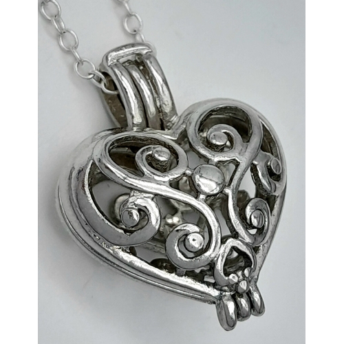 1191 - A 925 silver Filigree heart pendant, set on a silver chain necklace. Total weight 5.4G. Total length... 