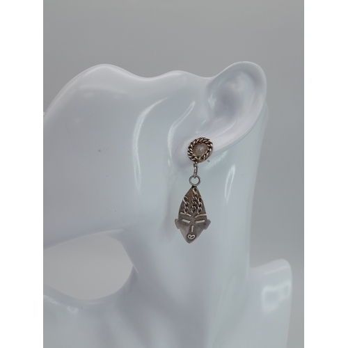 1255 - A Pair of Vintage Silver Drop Earrings with Tribal Mask Form. 5cm drop. 6.3g. No backs.