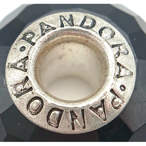 705 - A PAIR OF PANDORA, STERLING SILVER CHARMS. BLACK MURANO GLASS AND BLACK CHERRY BLOSSOM MURANO GLASS.... 