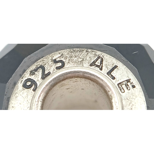 705 - A PAIR OF PANDORA, STERLING SILVER CHARMS. BLACK MURANO GLASS AND BLACK CHERRY BLOSSOM MURANO GLASS.... 