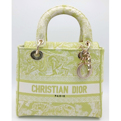 346 - A Christian Dior Green and White Lady D-Lite Bag. Toile de jouy embroidered textile exterior with go... 