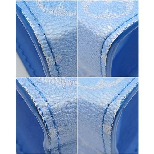 627 - A Louis Vuitton Monogram Clouds Pochette. Crafted in blue monogram coated canvas featuring the disti... 