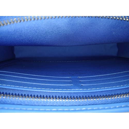 627 - A Louis Vuitton Monogram Clouds Pochette. Crafted in blue monogram coated canvas featuring the disti... 