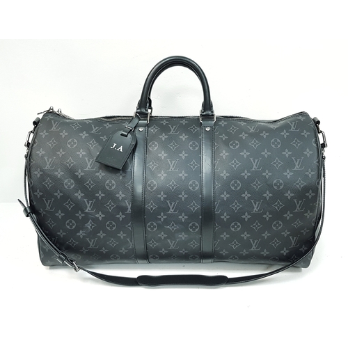 620 - A Louis Vuitton Monogram Eclipse Keepall Bandoulière 55 Travel Bag. Crafted in grey-on-black monogra... 