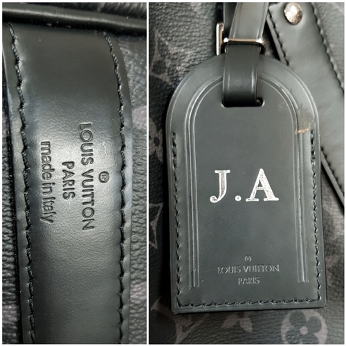 620 - A Louis Vuitton Monogram Eclipse Keepall Bandoulière 55 Travel Bag. Crafted in grey-on-black monogra... 