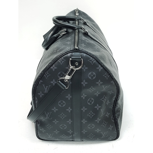 620 - A Louis Vuitton Monogram Eclipse Keepall Bandoulière 55 Travel Bag. Crafted in grey-on-black monogra... 