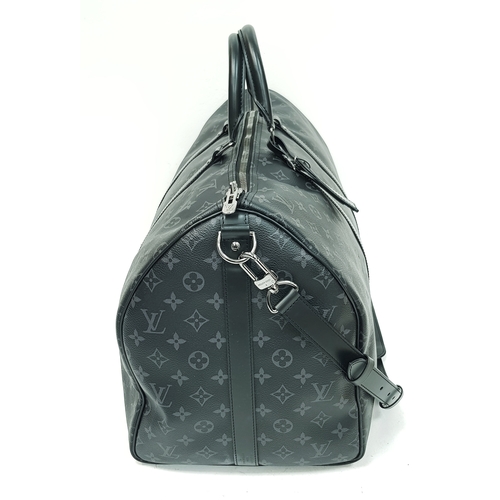 620 - A Louis Vuitton Monogram Eclipse Keepall Bandoulière 55 Travel Bag. Crafted in grey-on-black monogra... 