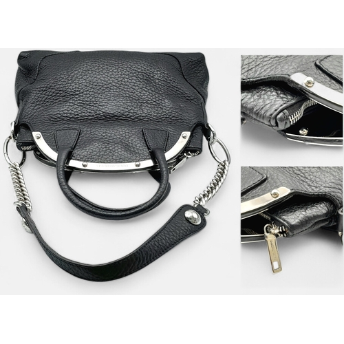 1150 - A Dolce & Gabbana Black Leather Handbag. Crafted from grained black leather with silver-tone hardwar... 