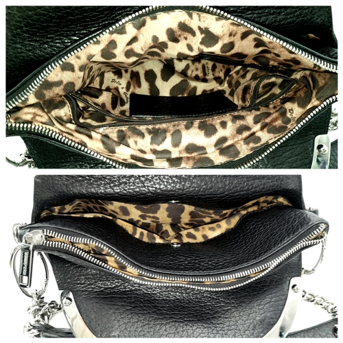 1150 - A Dolce & Gabbana Black Leather Handbag. Crafted from grained black leather with silver-tone hardwar... 