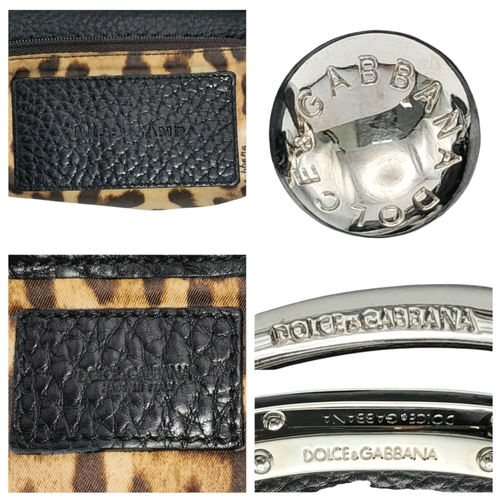 1150 - A Dolce & Gabbana Black Leather Handbag. Crafted from grained black leather with silver-tone hardwar... 