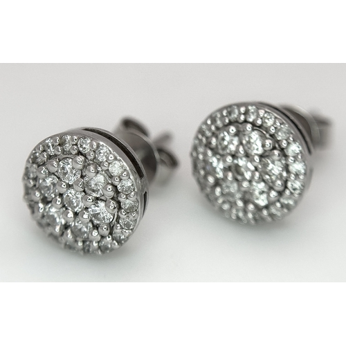 1164 - An 18K White Gold Diamond Cocktail Ring and a Pair of Diamond Cluster Stud Earrings. Ring, size P 1/... 