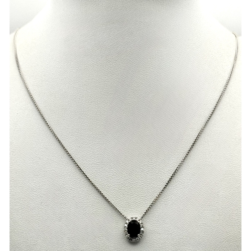 1188 - An 18K White Gold, Sapphire and Diamond Oval Shaped Pendant on an 18K White Gold Chain necklace. 0.7... 