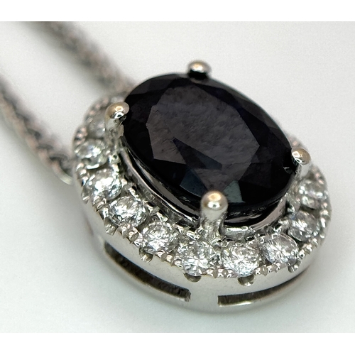 1188 - An 18K White Gold, Sapphire and Diamond Oval Shaped Pendant on an 18K White Gold Chain necklace. 0.7... 