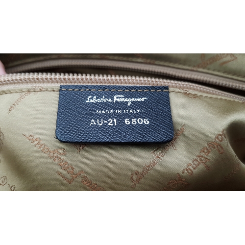 1195 - A Salvatore Ferragamo Black Leather Handbag. Crafted in structured black leather with silver-tone ha... 